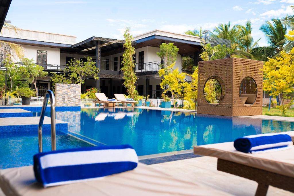 Pool and garden at Aathi Resort